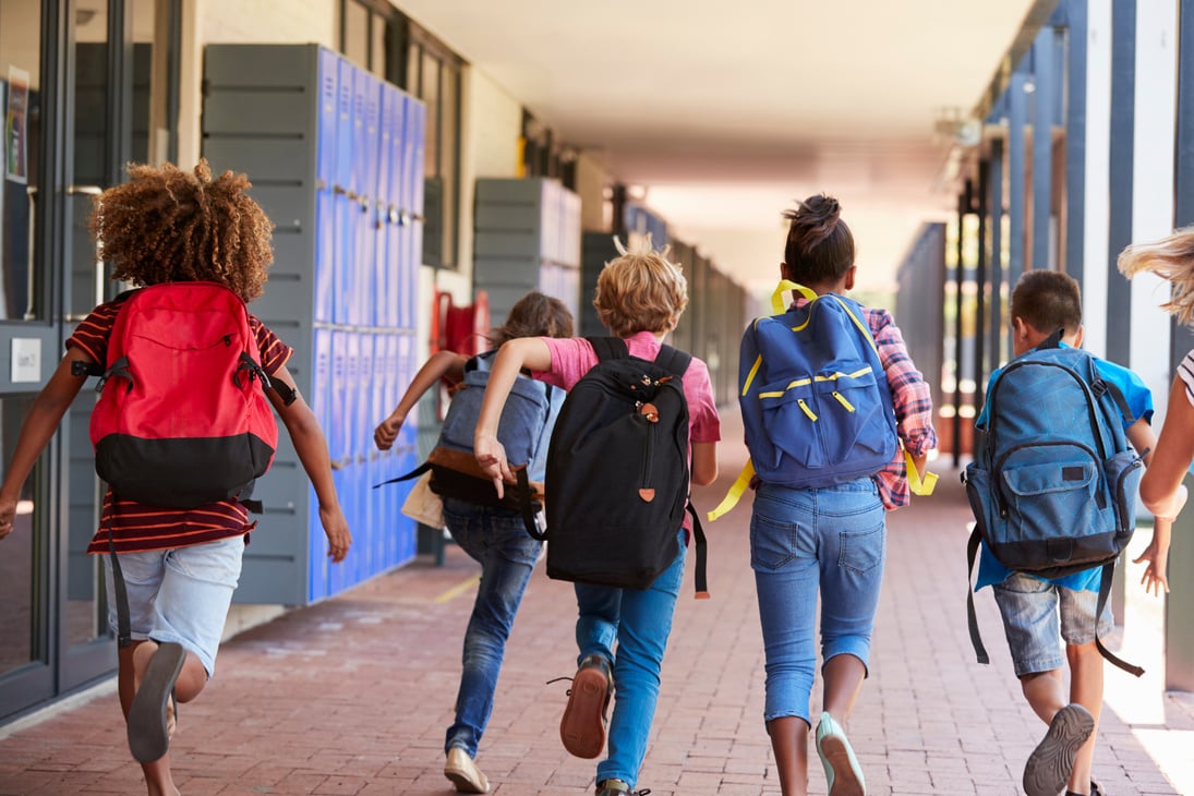 School Kids Running in Elementary School Hallway